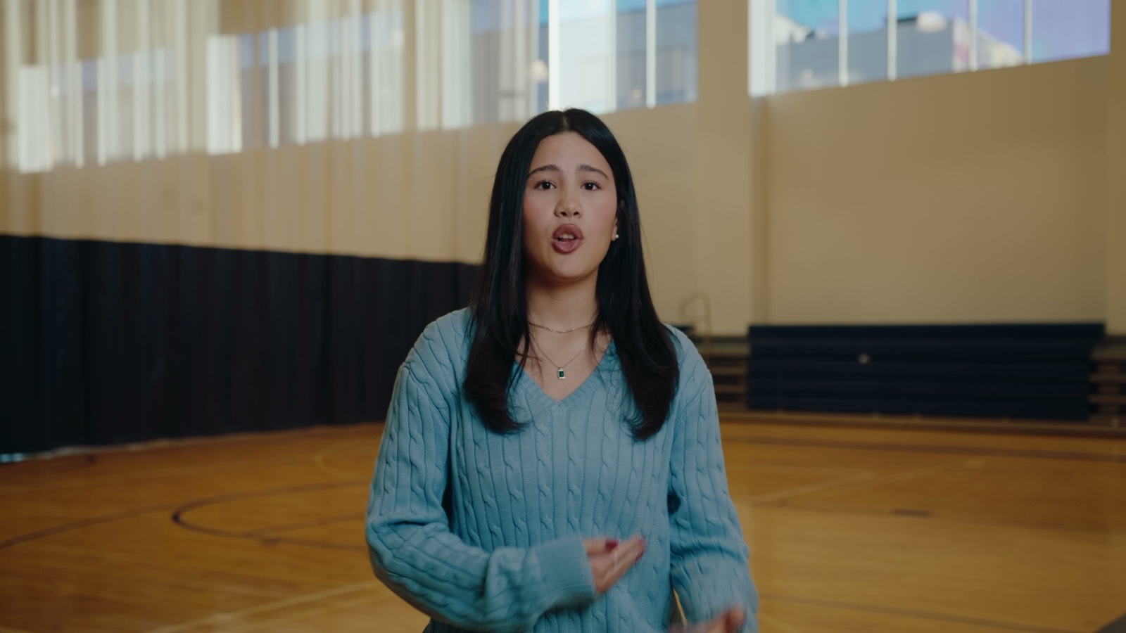 A student mid-sentence during her interview