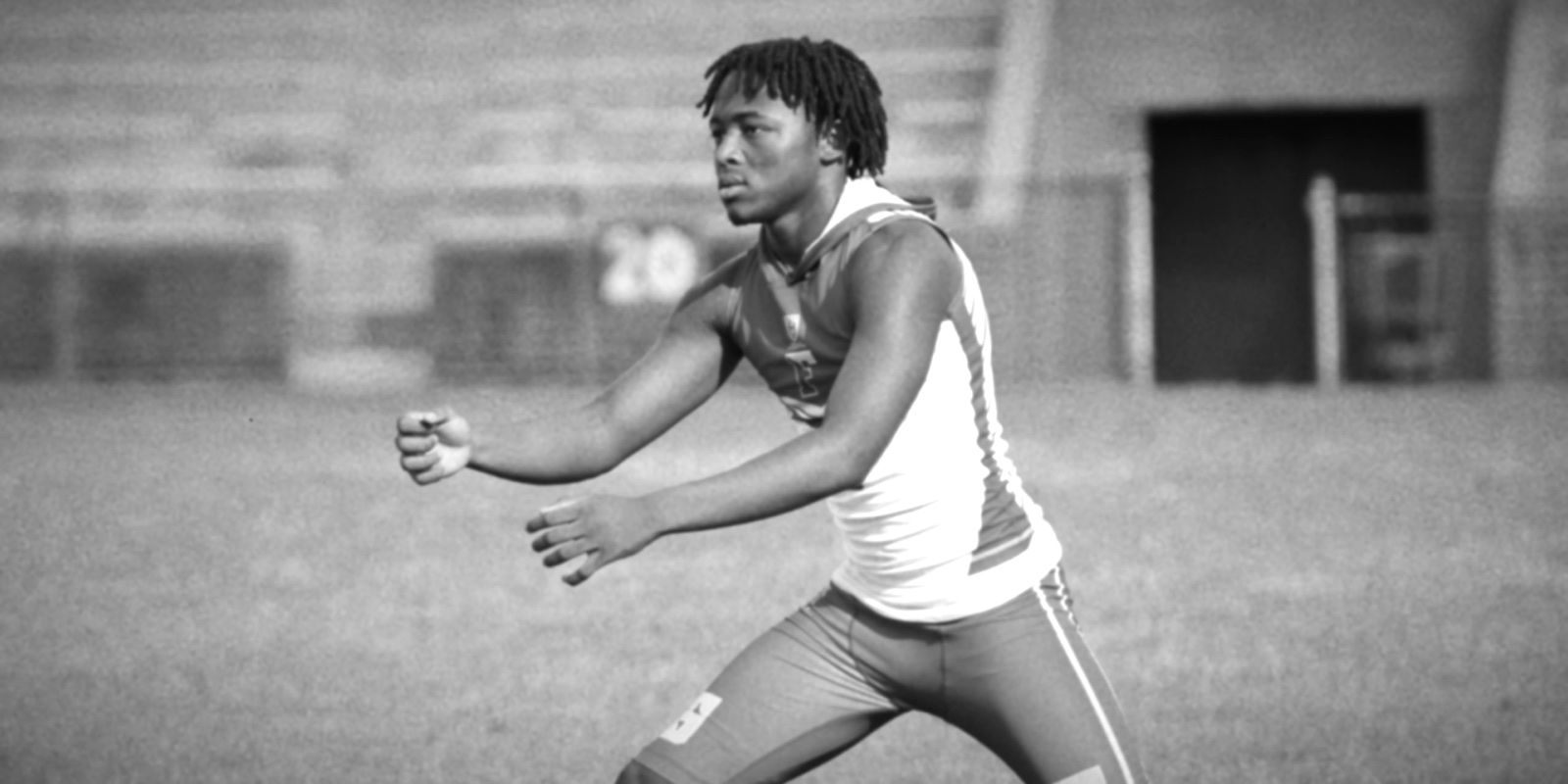 An athlete mid-throw on the field